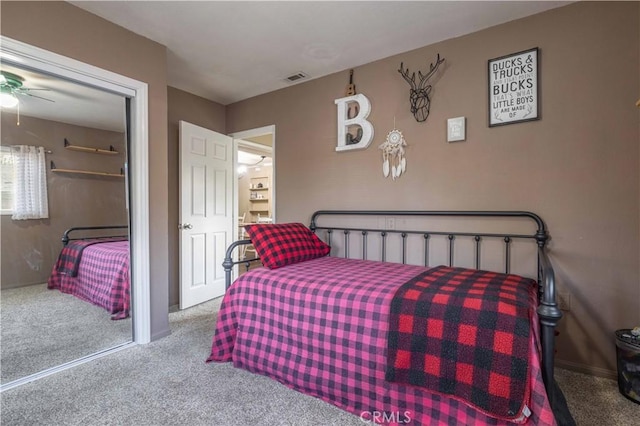 carpeted bedroom featuring visible vents