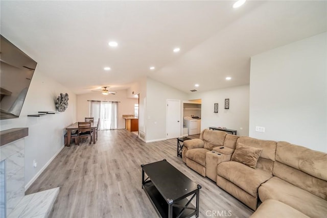 living room with recessed lighting, light wood-style flooring, vaulted ceiling, and a ceiling fan