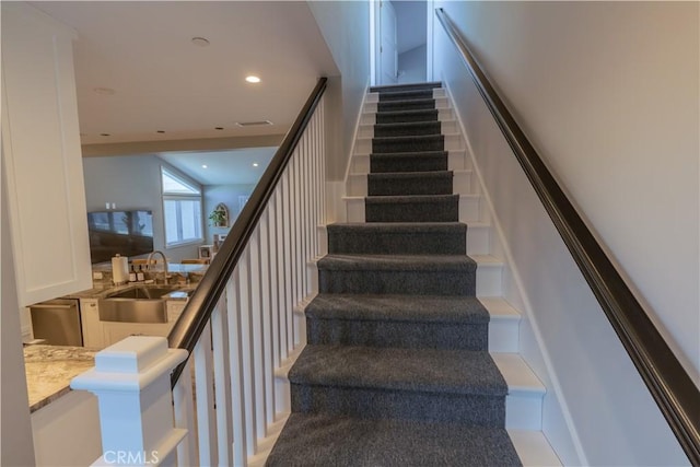 staircase with recessed lighting