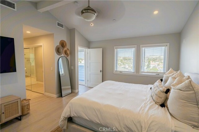 bedroom with visible vents, vaulted ceiling with beams, light wood-style flooring, and baseboards