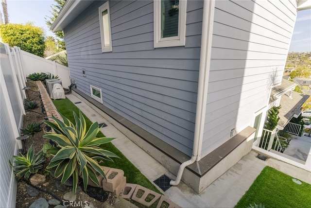 view of home's exterior with fence