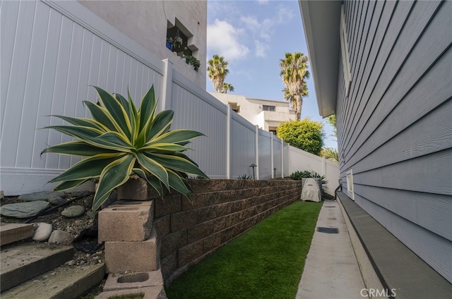 view of home's exterior featuring fence