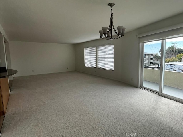 interior space with a chandelier and light colored carpet