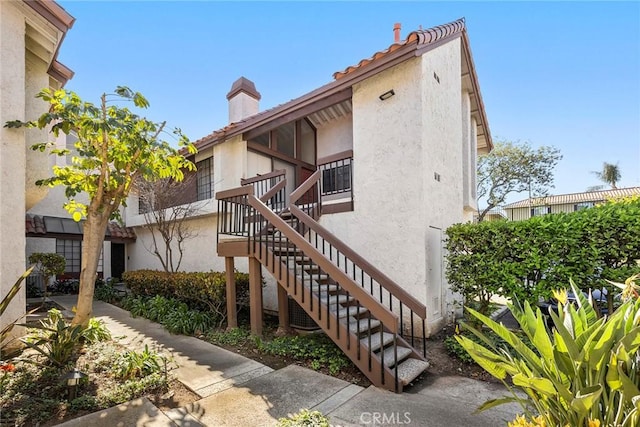 view of property featuring stairway