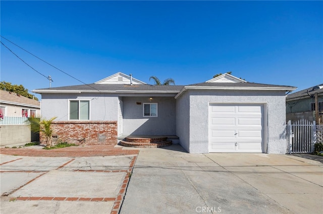 single story home with a garage, concrete driveway, crawl space, and fence