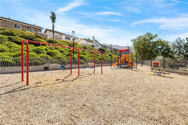 communal playground featuring fence