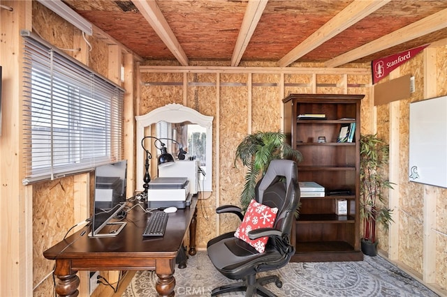 office space with beam ceiling