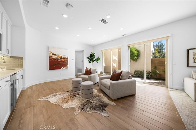 108 Catalyst, Irvine, CA 92618 - living area with light wood-style flooring, visible vents, and recessed lighting