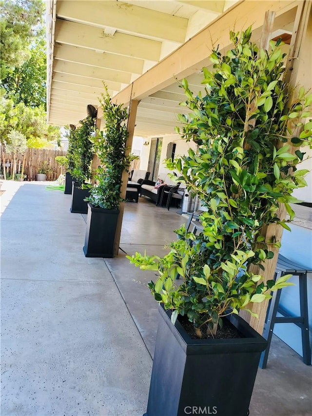 view of patio featuring fence