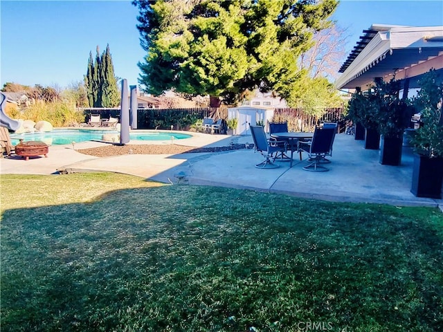 view of yard featuring a fenced backyard, a fenced in pool, and a patio