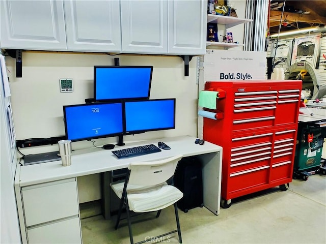 home office featuring concrete floors