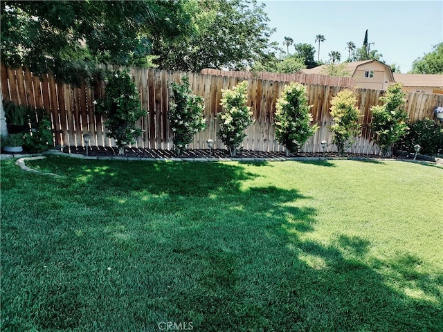 view of yard with fence