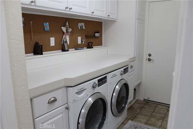 laundry area featuring cabinet space and separate washer and dryer