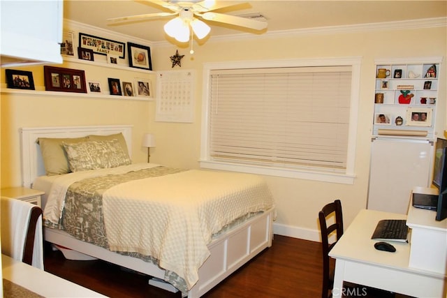 bedroom featuring dark wood-style floors, a ceiling fan, baseboards, and crown molding