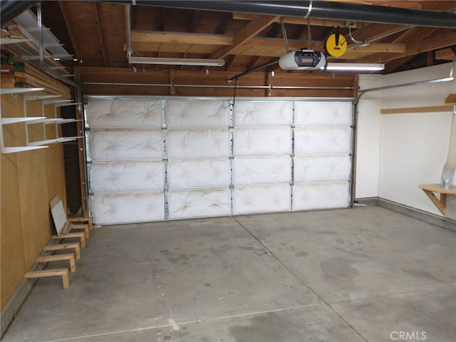 garage featuring baseboards and a garage door opener