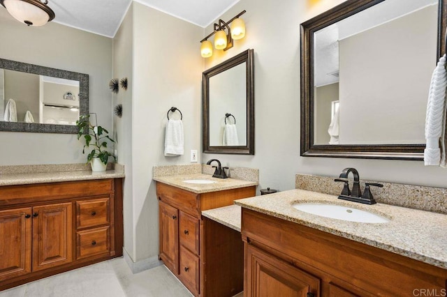 bathroom with two vanities and a sink