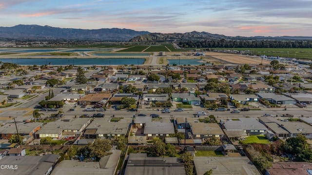 aerial view at dusk with a residential view and a mountain view