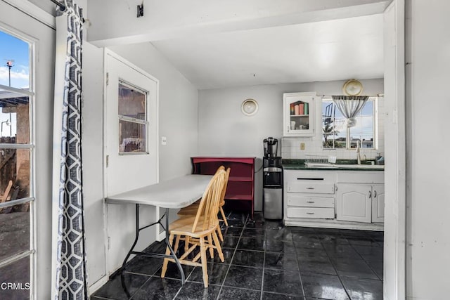 dining room featuring dark tile patterned floors