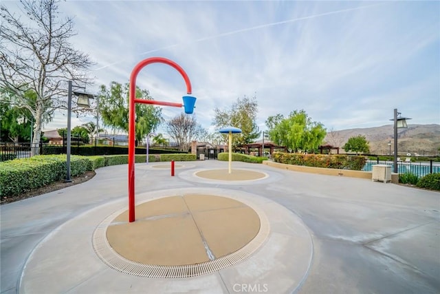 10916 Marygold, Corona, CA 92883 - view of property's community featuring community basketball court, fence, and a mountain view