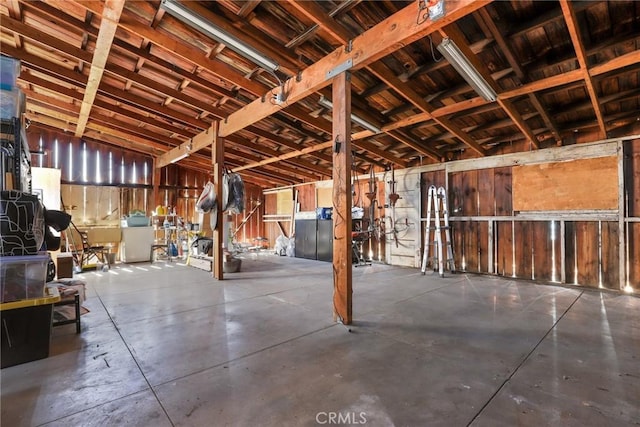 interior space with washer / dryer and concrete floors