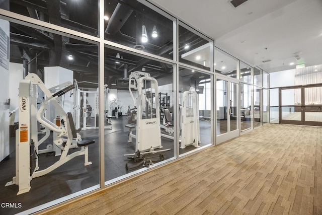 workout area with wood finished floors