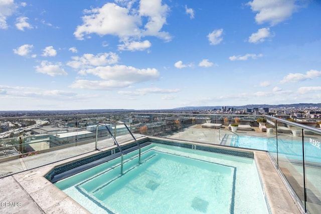 view of swimming pool featuring a community hot tub