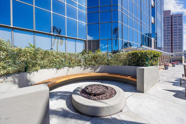 view of patio / terrace with a fire pit