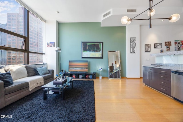 1100 Wilshire Blvd Unit 1808, Los Angeles, CA 90017 - living room with floor to ceiling windows and light wood-type flooring