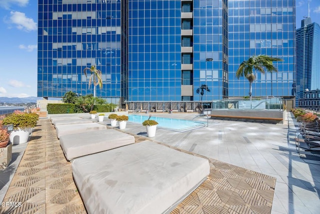 1100 Wilshire Blvd Unit 1808, Los Angeles, CA 90017 - community pool with a patio area and a mountain view