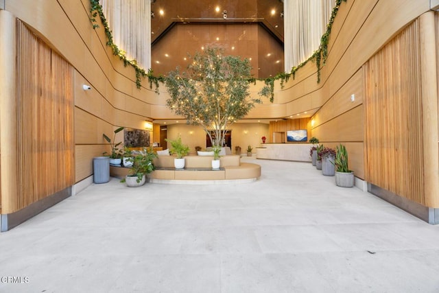 1100 Wilshire Blvd Unit 1808, Los Angeles, CA 90017 - common area featuring a towering ceiling and wood walls