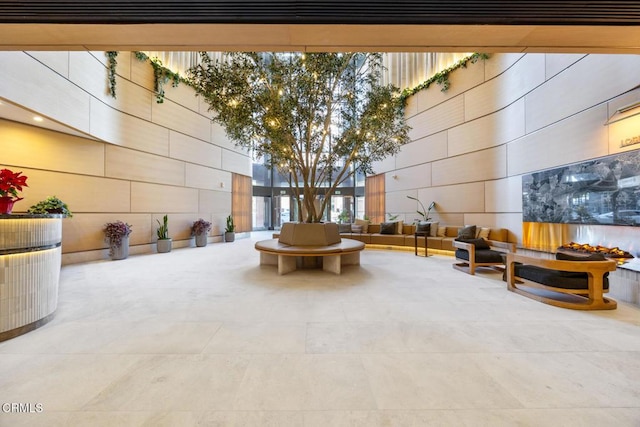 1100 Wilshire Blvd Unit 1808, Los Angeles, CA 90017 - lobby featuring wooden walls and a high ceiling