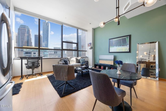 1100 Wilshire Blvd Unit 1808, Los Angeles, CA 90017 - living room featuring wood finished floors and a view of skyline