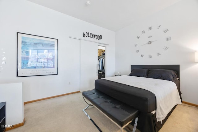 1100 Wilshire Blvd Unit 1808, Los Angeles, CA 90017 - bedroom featuring light carpet, a closet, and a walk in closet