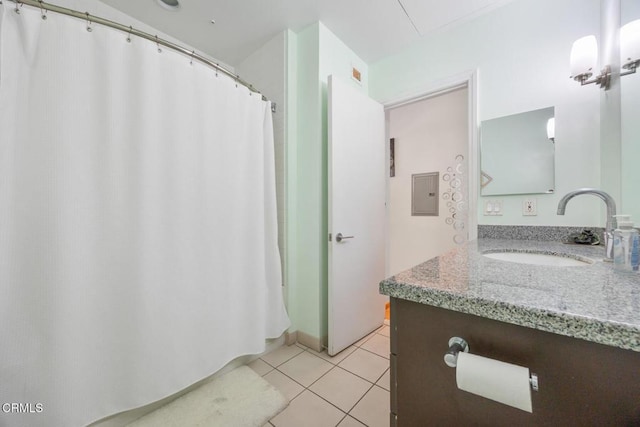 1100 Wilshire Blvd Unit 1808, Los Angeles, CA 90017 - full bathroom featuring vanity, tile patterned floors, and a shower with shower curtain