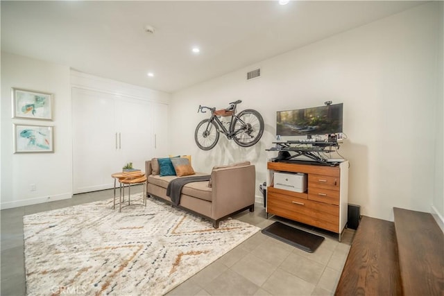 living area featuring recessed lighting, visible vents, and light tile patterned floors