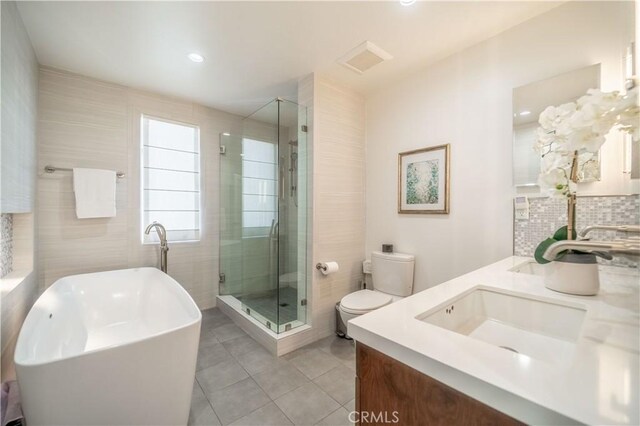 260 The Toledo, Long Beach, CA 90803 - bathroom featuring a sink, toilet, double vanity, and a stall shower