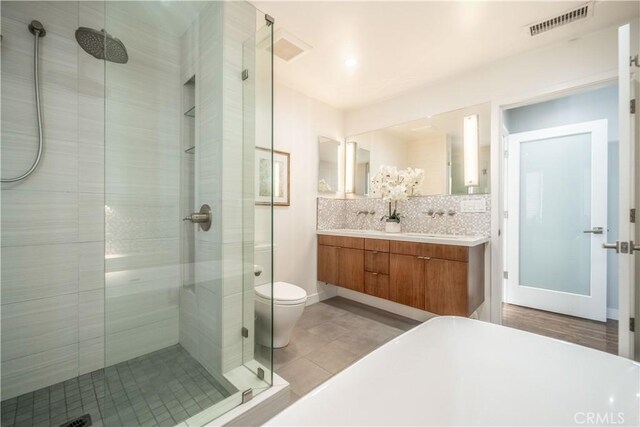 260 The Toledo, Long Beach, CA 90803 - bathroom featuring tasteful backsplash, double vanity, a stall shower, tile patterned flooring, and visible vents