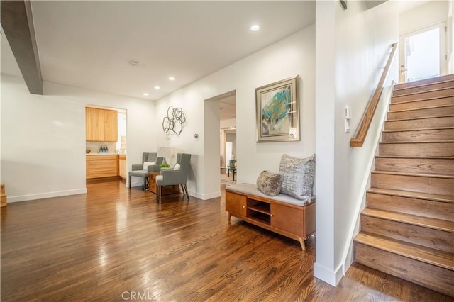 interior space with stairs, dark wood-style flooring, baseboards, and recessed lighting