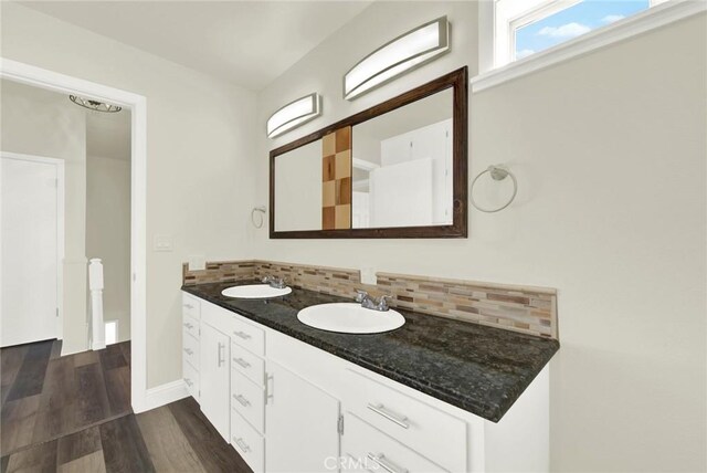 1495 S S, Corning, CA 96021 - bathroom with double vanity, backsplash, wood finished floors, and a sink