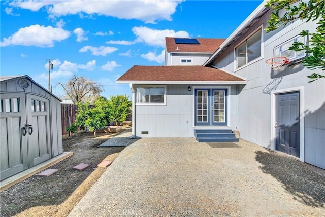 1495 S S, Corning, CA 96021 - exterior space with a shed, entry steps, roof with shingles, an outdoor structure, and a patio area
