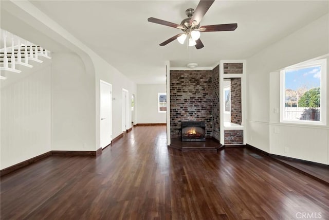1495 S S, Corning, CA 96021 - unfurnished living room with wood finished floors, a multi sided fireplace, and baseboards