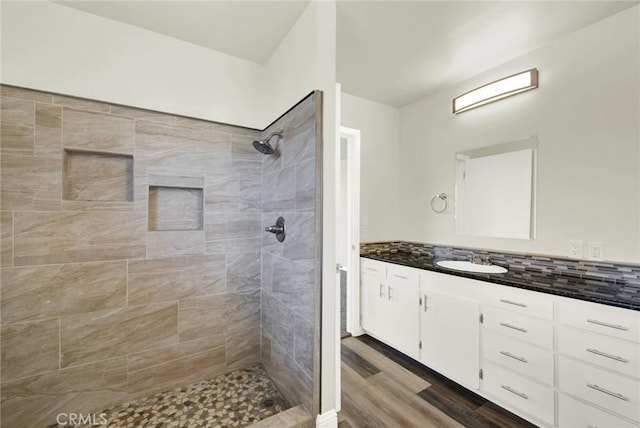 1495 S S, Corning, CA 96021 - bathroom featuring tiled shower, tasteful backsplash, wood finished floors, and vanity