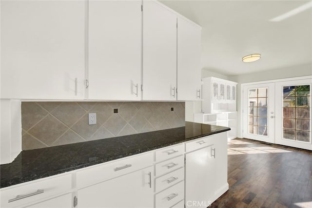 1495 S S, Corning, CA 96021 - kitchen with dark stone countertops, dark wood-style floors, french doors, white cabinetry, and backsplash