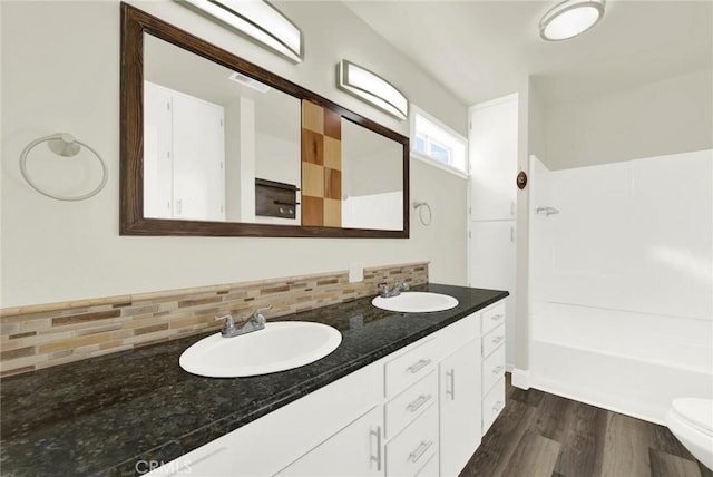 1495 S S, Corning, CA 96021 - full bathroom with decorative backsplash, double vanity, wood finished floors, and a sink