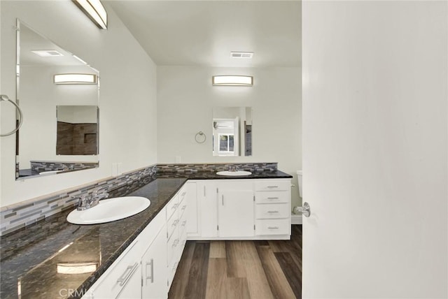1495 S S, Corning, CA 96021 - full bath featuring double vanity, visible vents, wood finished floors, and a sink