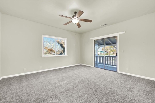 1495 S S, Corning, CA 96021 - spare room with visible vents, a ceiling fan, baseboards, and carpet floors
