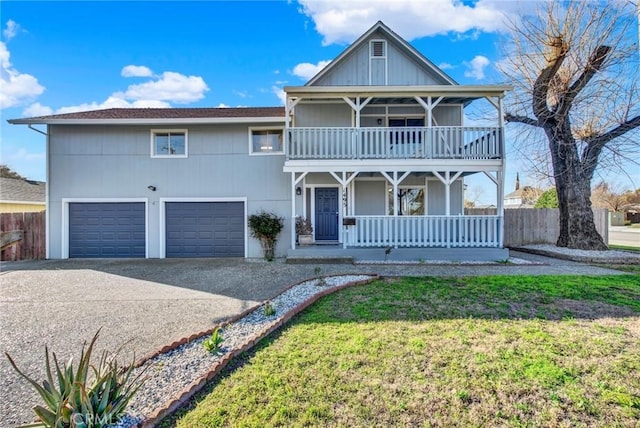 view of front of home featuring a front lawn, a porch, concrete driveway, a garage, and a balcony