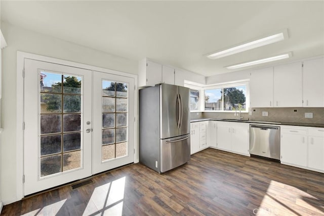 1495 S S, Corning, CA 96021 - kitchen with visible vents, stainless steel appliances, french doors, white cabinets, and dark wood-style flooring