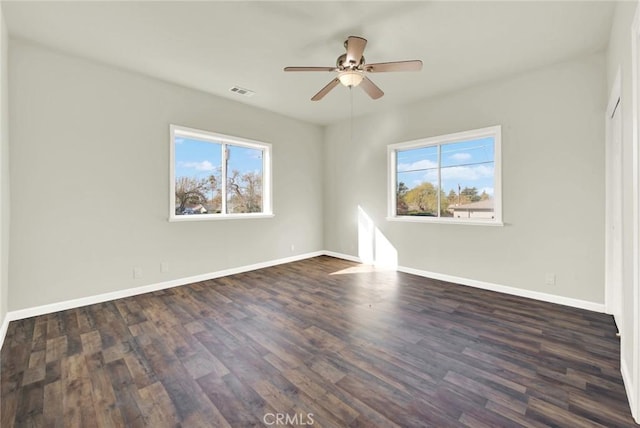 1495 S S, Corning, CA 96021 - spare room with dark wood-style floors, plenty of natural light, and baseboards