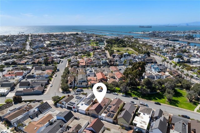 bird's eye view with a water view and a residential view